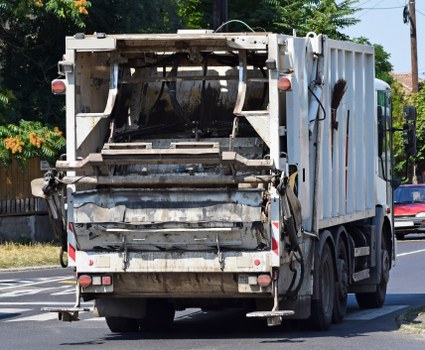 Incident response team addressing a spill during waste removal operations